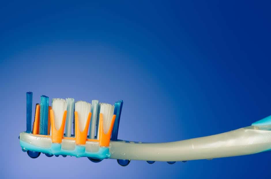 A close-up image of a clean toothbrush with bristles.
